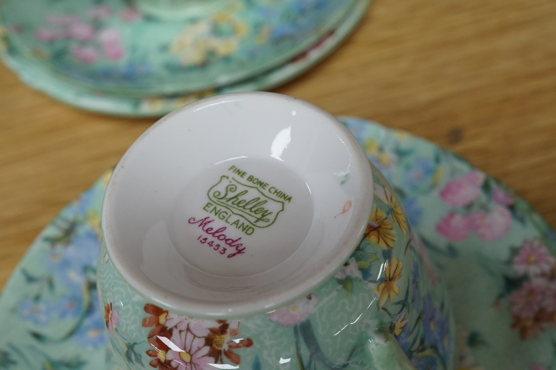 A Shelley ‘Melody’ porcelain six cup tea set, teapot missing, cake plate 25cm square (21)